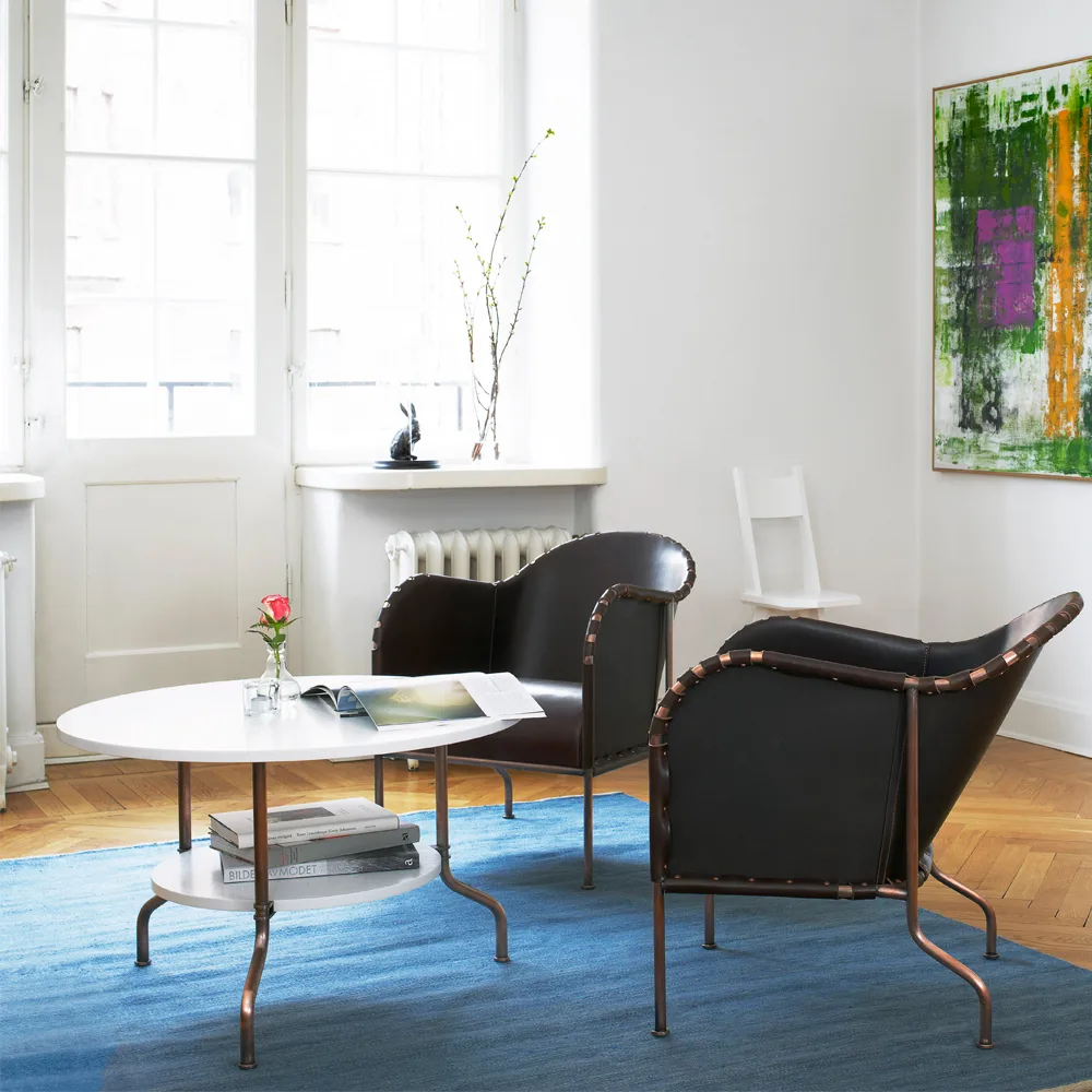 Bruno fåtölj, Kärnläder natur-mässingstativ Källemo