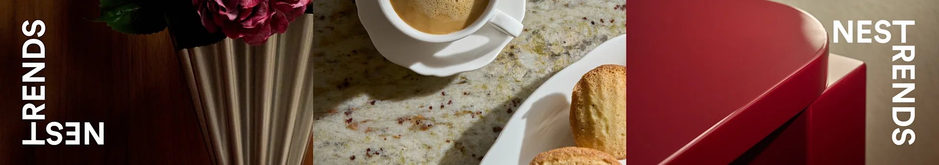 Kaffekopp, madeleinekakor och ros i räfflad vas på bänkskiva, bredvid röd låda med 'NEST TRENDS'.